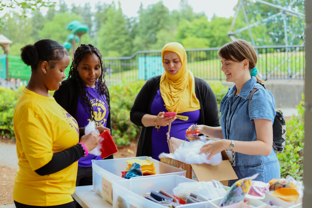 Mother Africa Summer Camp students and leaders work with TUP program